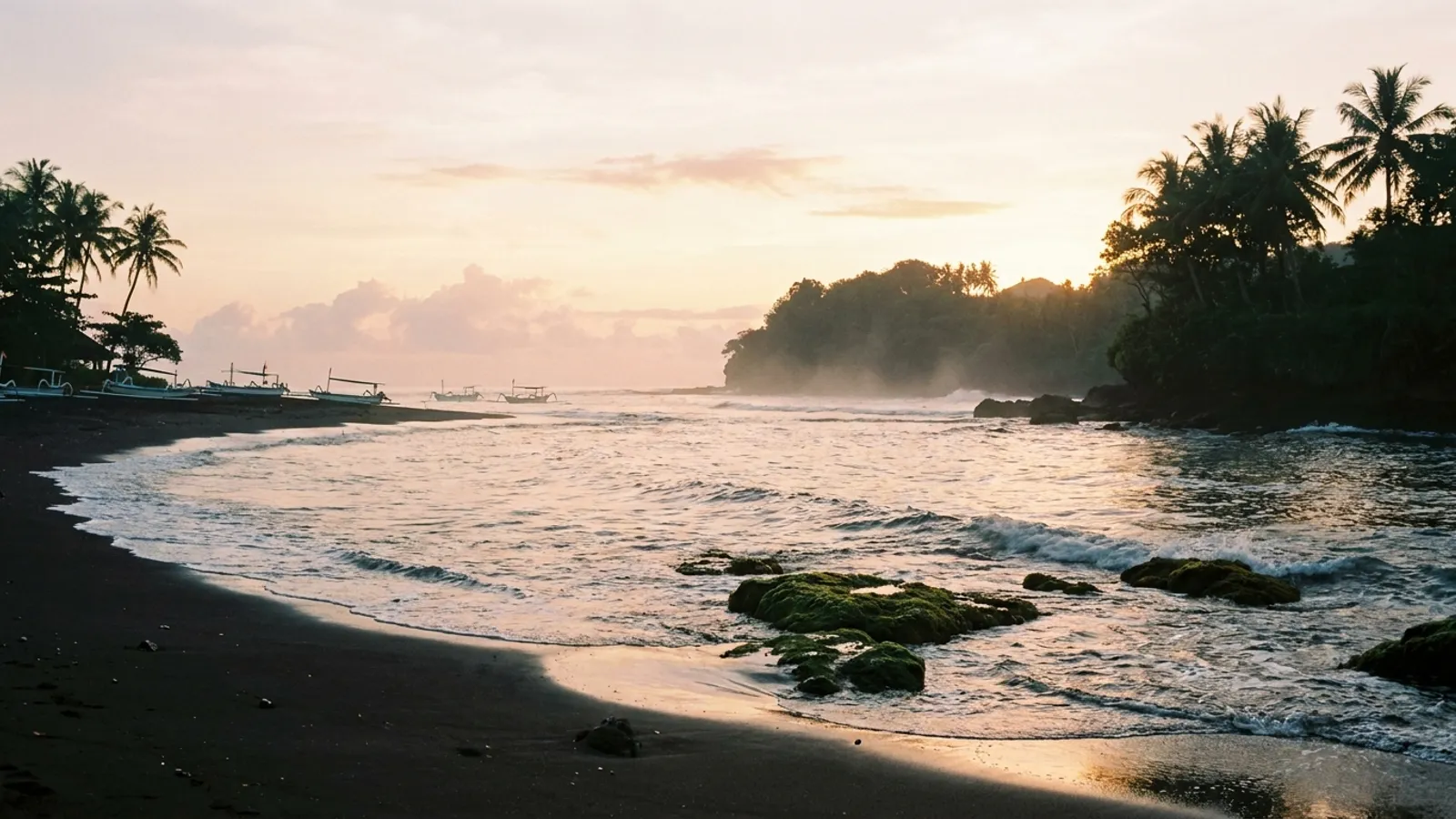Coastal landscape with a sunrise or sunset over the ocean.