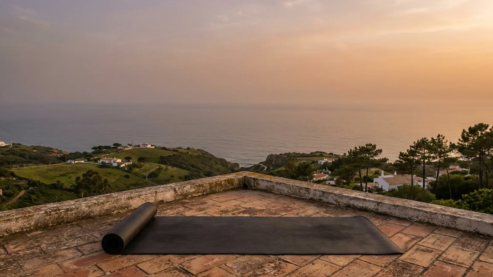 Scenic view of a Portuguese coastline with a yoga mat on a peaceful terrace